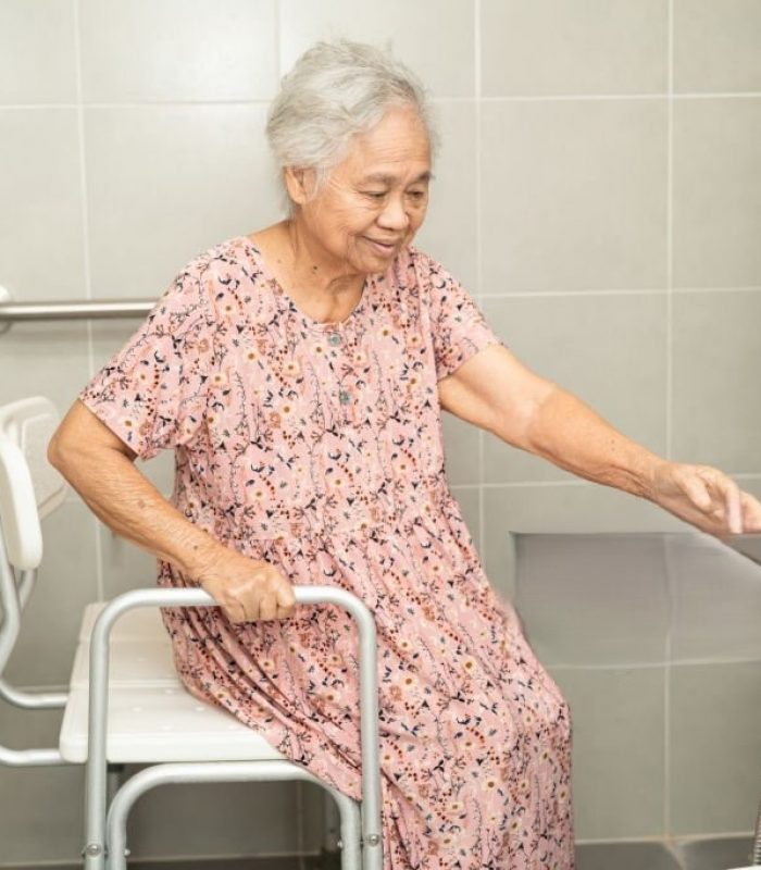 Asian senior or elderly old lady woman patient use toilet bathroom handle security in nursing hospital, healthy strong medical concept.